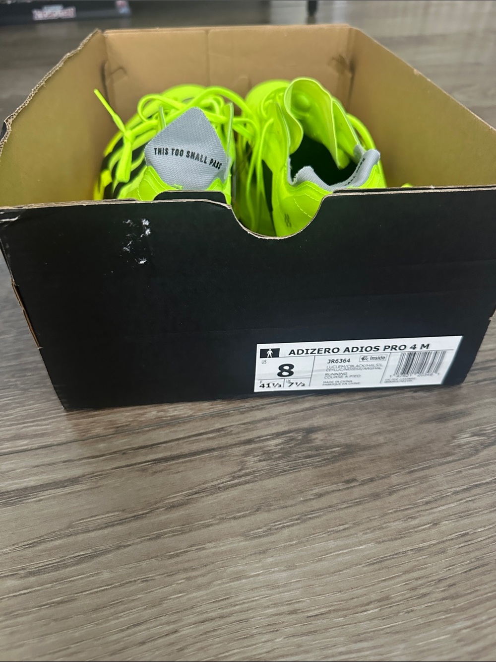 Adidas Adizero Adios Pro 4 lime green running shoes